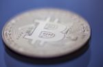 Macro Of Bitcoin Curency Dof On Blue Light Background Stock Photo