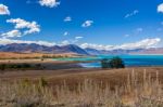 Distant View Of Lake Tekapo On A Summer's Day Stock Photo