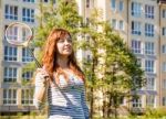 Young Beautiful Woman Playing Badminton Stock Photo