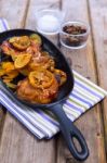 Delicious Baked Chicken Thighs With Lemon Slices, Onion And Zucchini Stock Photo