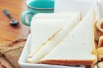 Breads And Cup On Wooden Stock Photo