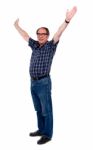 Mature Man Standing With Open Arms Stock Photo