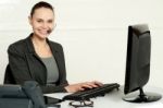 Female Employee Assisting Customers Stock Photo