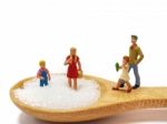 Miniature Little Children Standing On A Wooden Spoon And Thinking Of Sugar, Diet, Fat And Diabetes. Health Care Concept Stock Photo