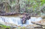 The Water Flowing Over Rocks And Trees Down A Waterfall At Huay Mae Khamin Waterfall National Park ,kanchana Buri In Thailand Stock Photo