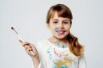 Cute Little Girl With A Painting Brush Stock Photo