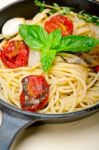 Spaghetti Pasta With Baked Cherry Tomatoes And Basil Stock Photo