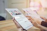 Business Women Are Using A Tablet Screen With A Video Call Teams. Video Calling Is A Technology That Makes Communication Fast And Error-free Stock Photo