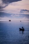 Fisherman On Boat Stock Photo