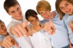 Smiling Teenagers Pointing Upward Stock Photo