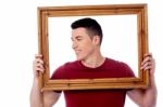 Man Holding Wooden Picture Frame Stock Photo