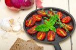 Baked Cherry Tomatoes With Basil And Thyme Stock Photo