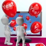 Yes Balloons From Computer Showing Approval And Support Message Stock Photo