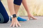 Woman In Gesture Ready To Run On Road During Evening Stock Photo