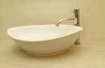 Ceramic Handbasin On Countertop Stock Photo