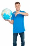 Young Male Holding Globe Stock Photo