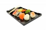 Sushi Black Rectangle Plate Focus Shrimp On White Table Stock Photo