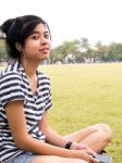 A Young Girl With Headphones Outdoors. Listening Music Stock Photo