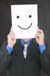 Young Businessman Hiding His Face With A White Billboard With A Stock Photo