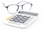 Calculator With Eyeglasses Isolated On White Background Stock Photo