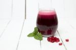 Fresh Tropical Pomegranate Juice Isolated On A White Background Stock Photo