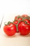 Fresh Cherry Tomatoes On A Cluster Stock Photo