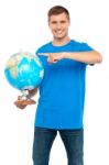 Young Male Holding Globe Stock Photo