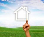 Hand Touching House Icon Stock Photo