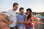 Three Friends Taking Selfie On The Bridge Stock Photo