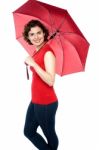 Beautiful Woman Holding A Red Umbrella Stock Photo