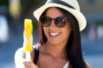 Portrait Of Beautiful Girl Eating Ice Cream Stock Photo