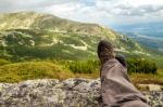 Trekker Resting In The Mountains Stock Photo