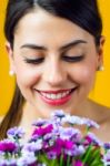 Happy Young Girl With Flowers Stock Photo