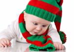 Baby With Christmas Hat And Scarf Stock Photo