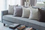 Row Of Pillows On Modern Grey Sofa Stock Photo