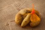 Potato Still Life On Sack Background Stock Photo