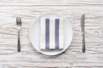 Empty Plate Napkin Fork Knife Silverware White Wooden Table Background Stock Photo