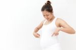 Pregnant Woman Touching Her Belly Stock Photo