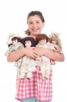 Little Girl With Dolls Stock Photo