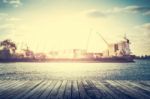 Wooden Pier With Shipping Port Stock Photo