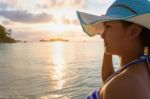 Girl On The Beach At Sunrise Stock Photo