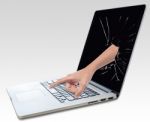 Laptop With Broken Screen And Hand Stock Photo