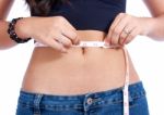 Girl Checking Her Waistline Stock Photo