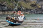 Fishing Boat In Port Isaac Cornwall Stock Photo