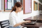 Portrait Of Thai Adult Businesswoman Beautiful Girl Using Computer Notebook Stock Photo