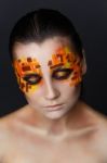 Orange And Red Rhinestones On A Girl Face Stock Photo