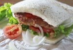 Fried Meat Sandwich Bread With Green Vegetable Tomato And Onion Stock Photo