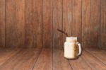 Iced Coffee On Old Wooden Interior Texture Background Stock Photo