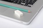 Pencil And Eraser On The Laptop Stock Photo