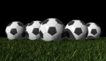 Soccer Balls On Grass Stock Photo